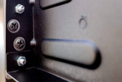 Screws, nuts screwed to metal plate, fastener installation